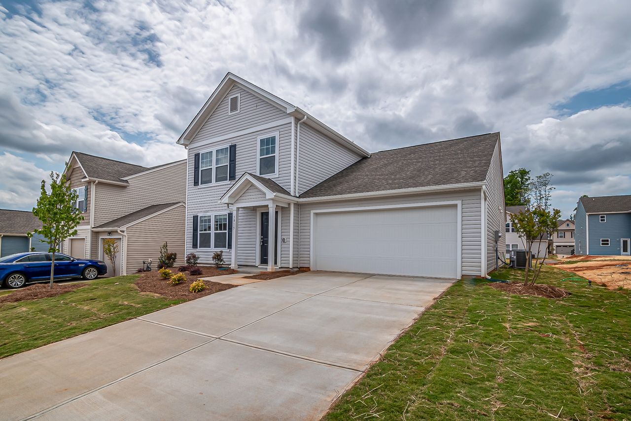 Example of a two-car attached garage on a single-family home — a typical starting point for a conversion